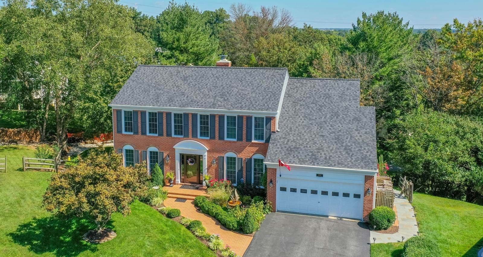 two story red brick home